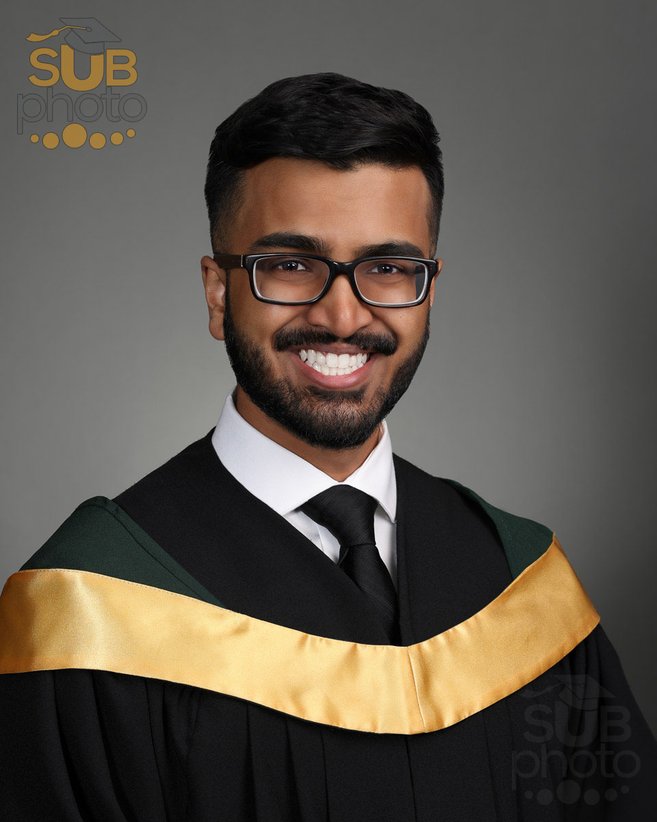 Graduate wearing classic dress shirt and black tie