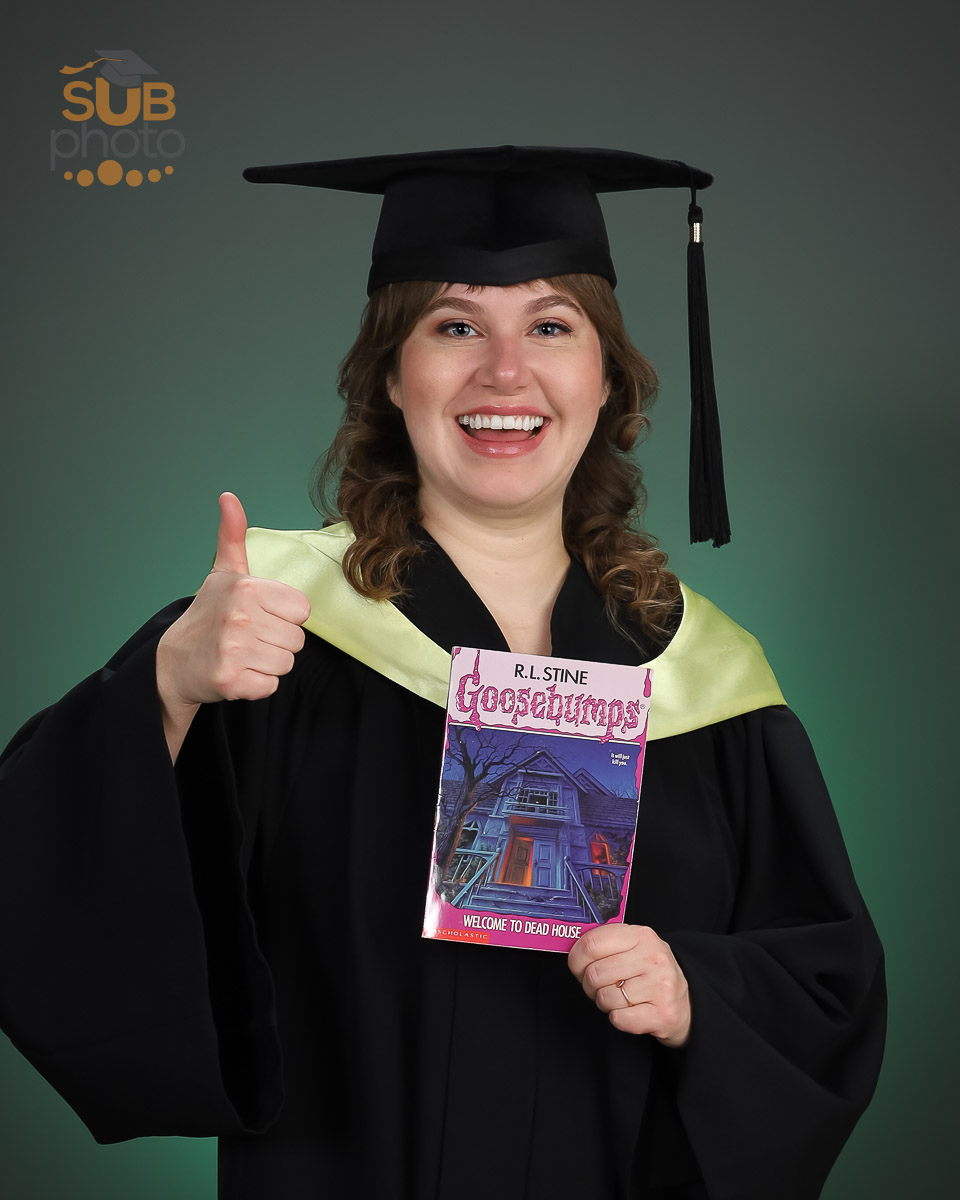 Portrait of grad with a favourite book