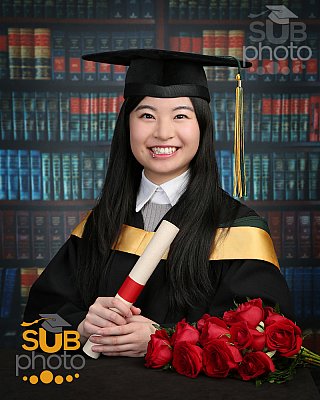Grad photo with book background, girl wearing closed collar